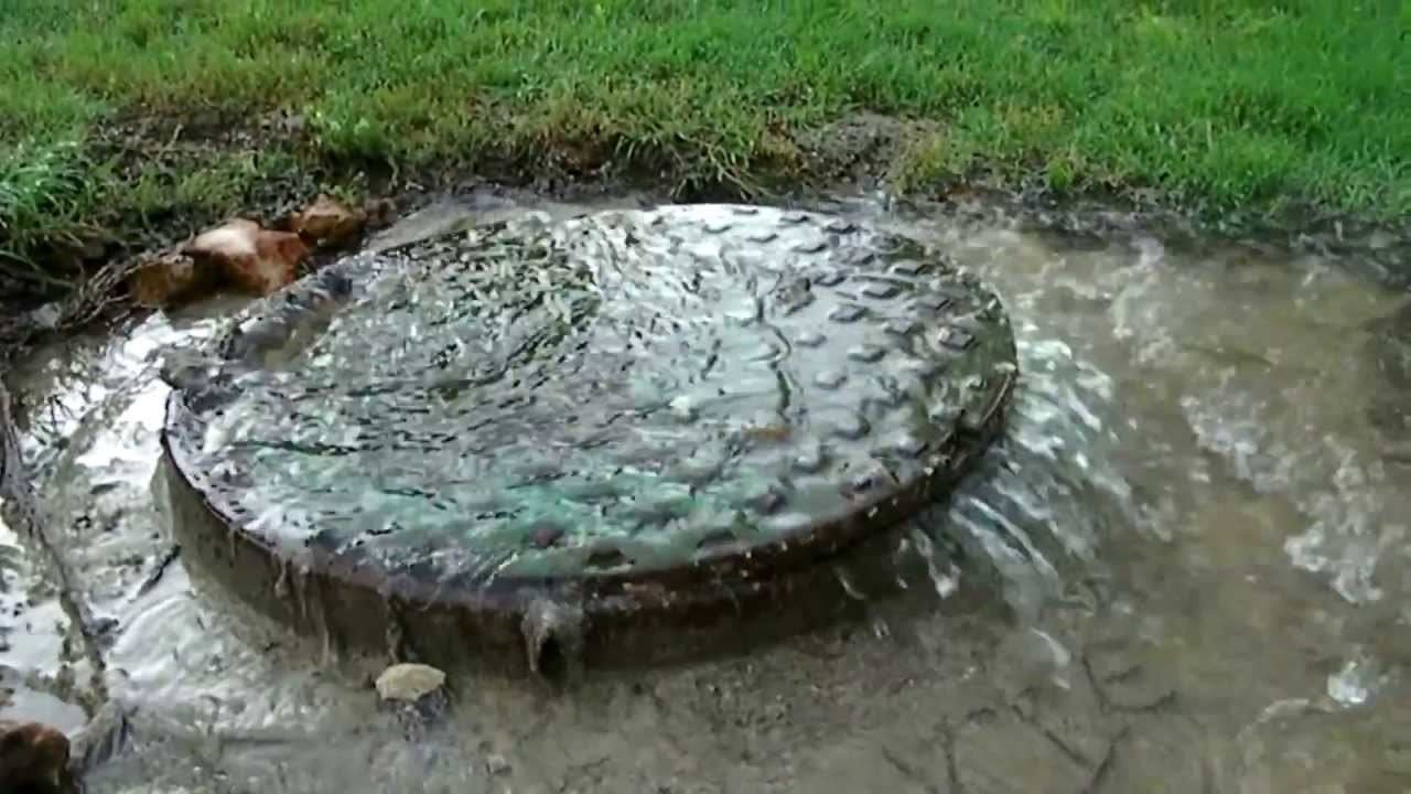 Water overflowing out of a drain
